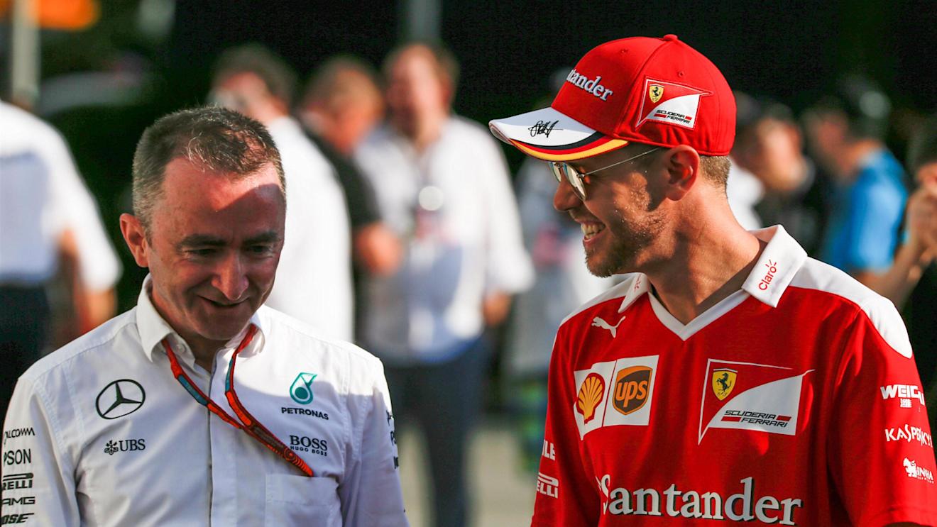 Paddy Lowe (GBR) Mercedes AMG F1 Executive Director (Technical) and Sebastian Vettel (GER) Ferrari at Formula One World Championship, Rd15, Singapore Grand Prix, Race, Marina Bay Street Circuit, Singapore, Sunday 18 September 2016. © Sutton Images