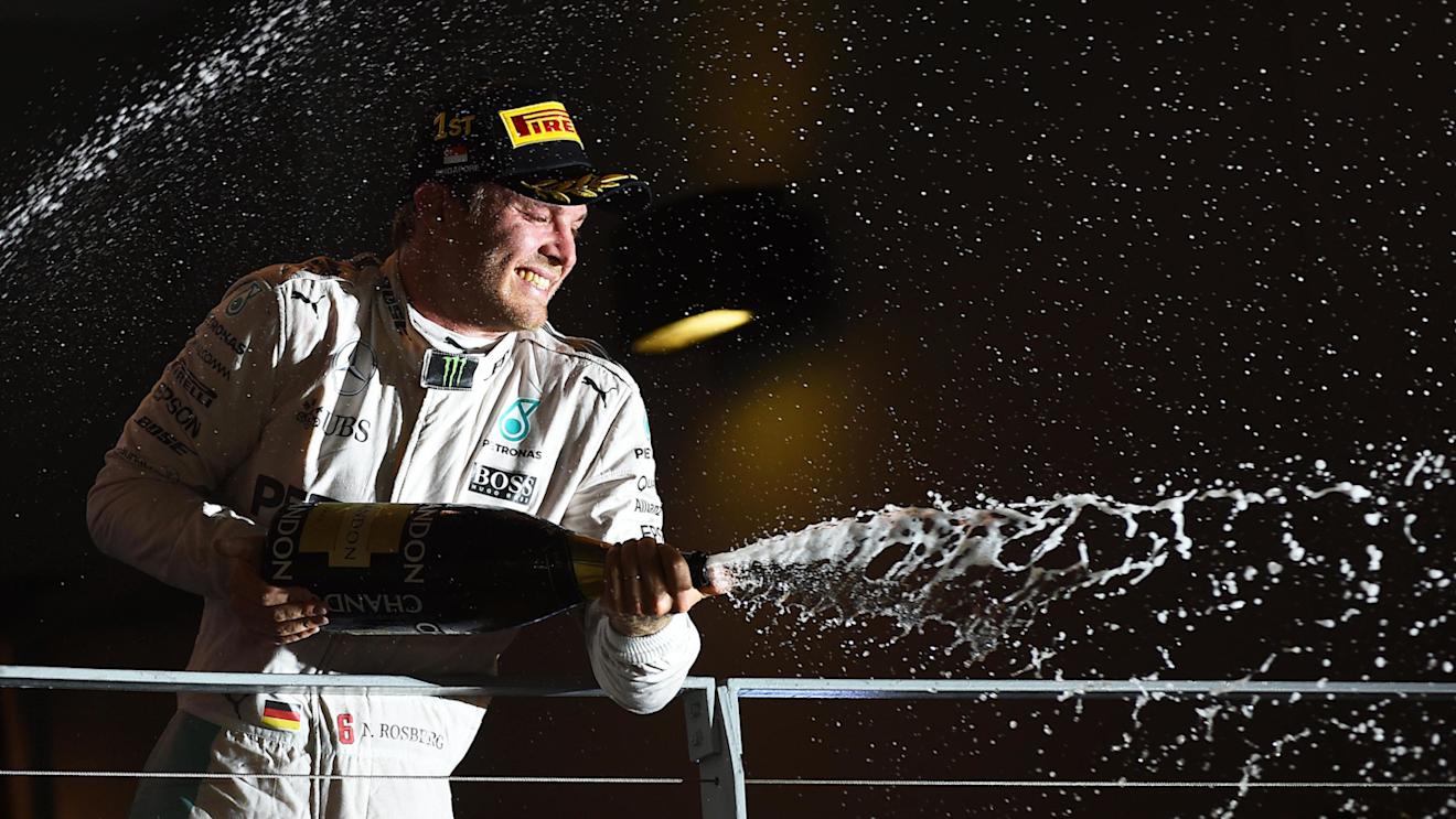 Race winner Nico Rosberg (GER) Mercedes AMG F1 celebrates on the podium with the champagne at Formula One World Championship, Rd15, Singapore Grand Prix, Race, Marina Bay Street Circuit, Singapore, Sunday 18 September 2016. © Sutton Images