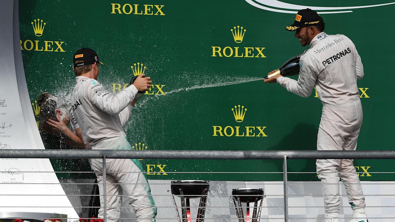 Nico Rosberg (GER) Mercedes AMG F1 and Lewis Hamilton (GBR) Mercedes AMG F1 celebrate on the podium with the champagne at Formula One World Championship, Rd18, United States Grand Prix, Race, Circuit of the Americas, Austin, Texas, USA, Sunday 23 October 2016. © Sutton Images