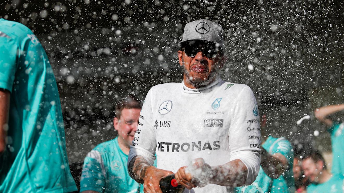 Race winner Lewis Hamilton (GBR) Mercedes AMG F1 celebrates with the team and the champagne at Formula One World Championship, Rd18, United States Grand Prix, Race, Circuit of the Americas, Austin, Texas, USA, Sunday 23 October 2016. © Sutton Images