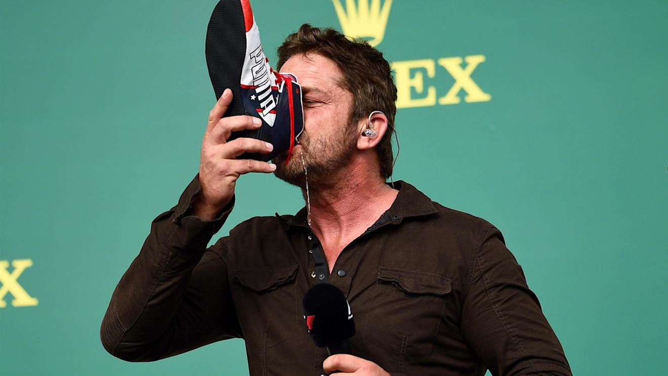 Gerard Butler (GBR) Actor drinks from the boot of Daniel Ricciardo (AUS) Red Bull Racing on the podium at Formula One World Championship, Rd18, United States Grand Prix, Race, Circuit of the Americas, Austin, Texas, USA, Sunday 23 October 2016. © Sutton Images