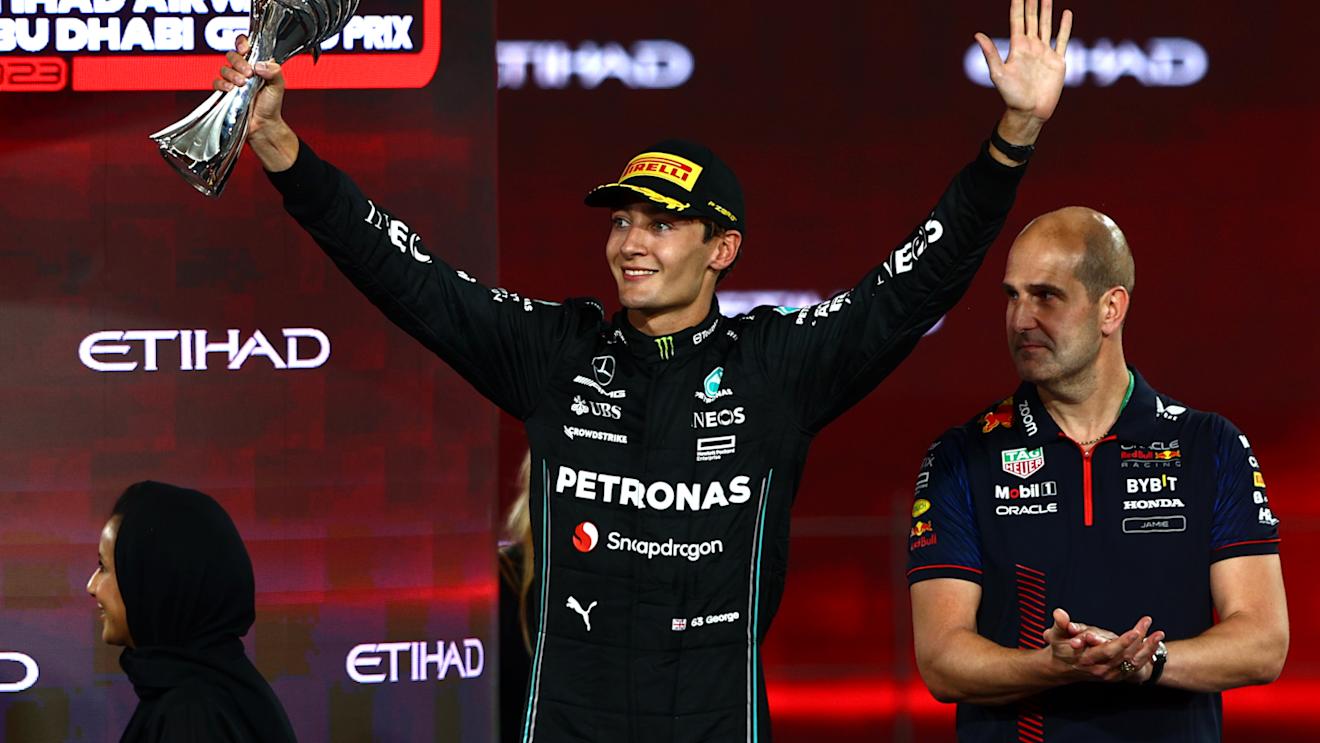 ABU DHABI, UNITED ARAB EMIRATES - NOVEMBER 26: Third placed George Russell of Great Britain and Mercedes celebrates on the podium during the F1 Grand Prix of Abu Dhabi at Yas Marina Circuit on November 26, 2023 in Abu Dhabi, United Arab Emirates. (Photo by Clive Rose/Getty Images)