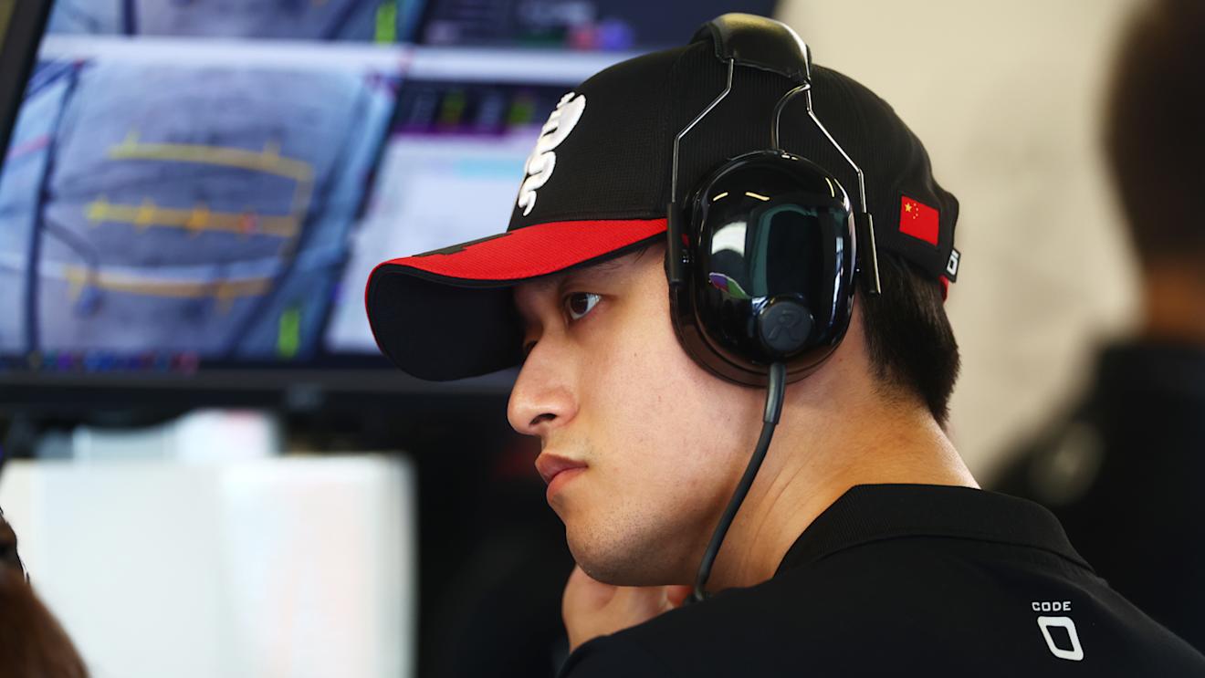 ABU DHABI, UNITED ARAB EMIRATES - NOVEMBER 24: Zhou Guanyu of China and Alfa Romeo F1 looks on in the garage during practice ahead of the F1 Grand Prix of Abu Dhabi at Yas Marina Circuit on November 24, 2023 in Abu Dhabi, United Arab Emirates. (Photo by Dan Istitene - Formula 1/Formula 1 via Getty Images)