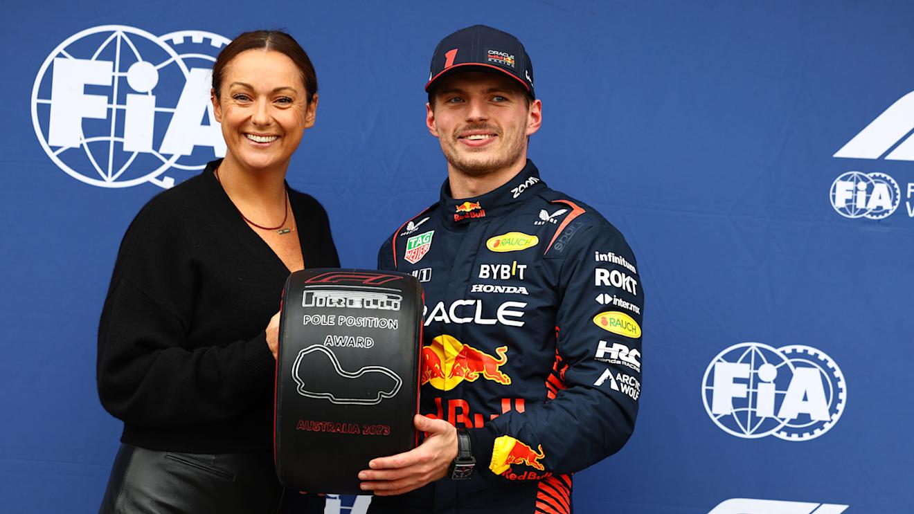 MELBOURNE, AUSTRALIA - APRIL 01: Pole position qualifier Max Verstappen of the Netherlands and Oracle Red Bull Racing is presented with the Pirelli Pole Position trophy by Celeste Barber in parc ferme during qualifying ahead of the F1 Grand Prix of Australia at Albert Park Grand Prix Circuit on April 01, 2023 in Melbourne, Australia. (Photo by Mark Thompson/Getty Images)