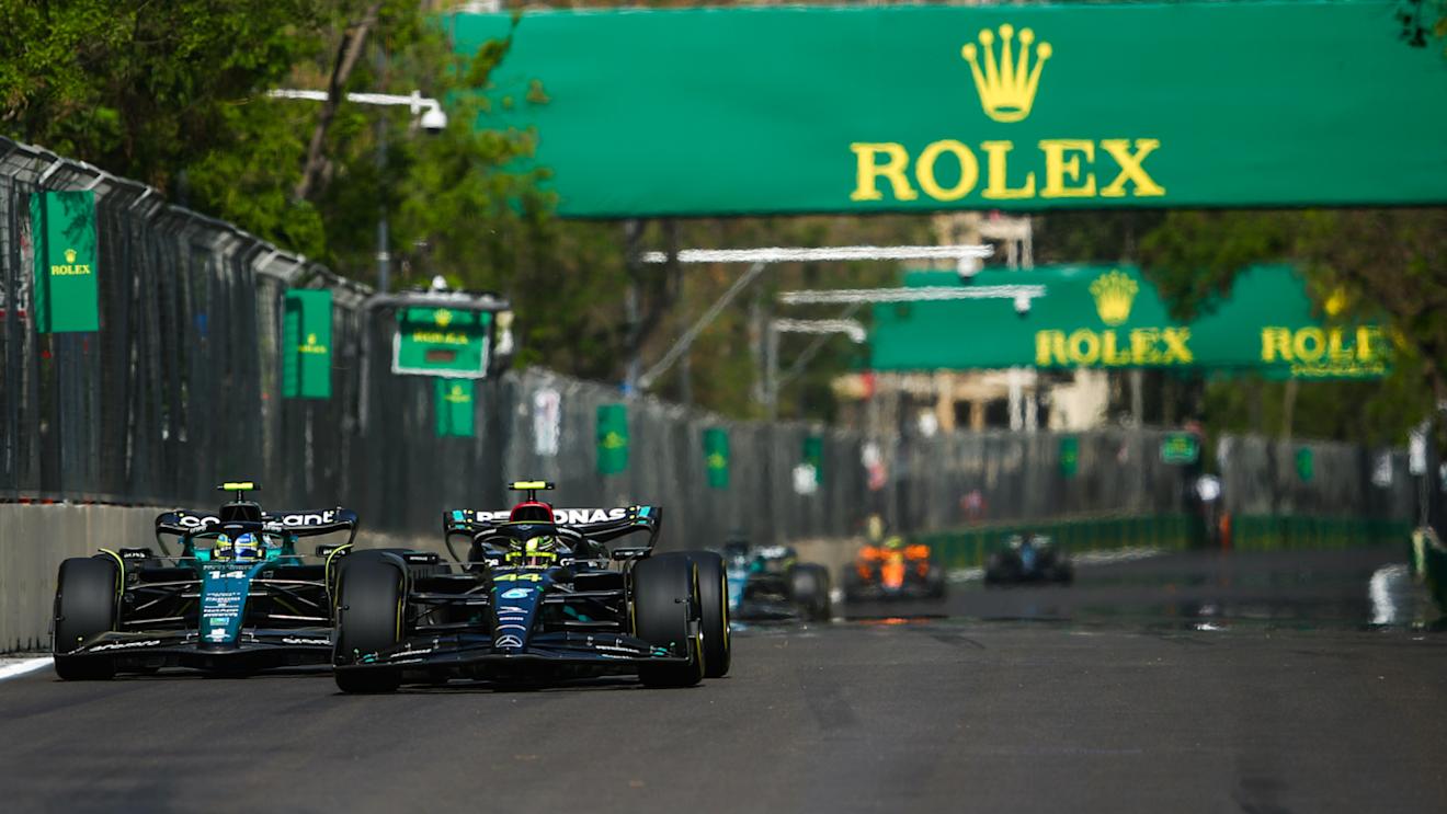 BAKU, AZERBAIJAN - APRIL 30: Lewis Hamilton of Great Britain driving the (44) Mercedes AMG Petronas F1 Team W14 leads Fernando Alonso of Spain driving the (14) Aston Martin AMR23 Mercedes on track during the F1 Grand Prix of Azerbaijan at Baku City Circuit on April 30, 2023 in Baku, Azerbaijan. (Photo by Joe Portlock - Formula 1/Formula 1 via Getty Images)