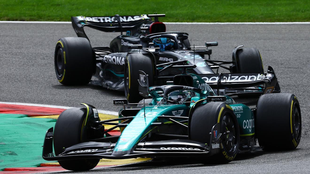 SPA, BELGIUM - JULY 30: Lance Stroll of Canada driving the (18) Aston Martin AMR23 Mercedes George Russell of Great Britain driving the (63) Mercedes AMG Petronas F1 Team W14 on track during the F1 Grand Prix of Belgium at Circuit de Spa-Francorchamps on July 30, 2023 in Spa, Belgium. (Photo by Mark Thompson/Getty Images)
