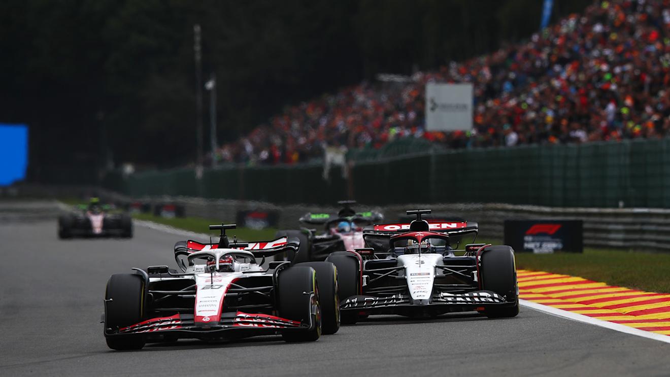 SPA, BELGIUM - JULY 30: Kevin Magnussen of Denmark driving the (20) Haas F1 VF-23 Ferrari leads Daniel Ricciardo of Australia driving the (3) Scuderia AlphaTauri AT04 during the F1 Grand Prix of Belgium at Circuit de Spa-Francorchamps on July 30, 2023 in Spa, Belgium. (Photo by Joe Portlock - Formula 1/Formula 1 via Getty Images)