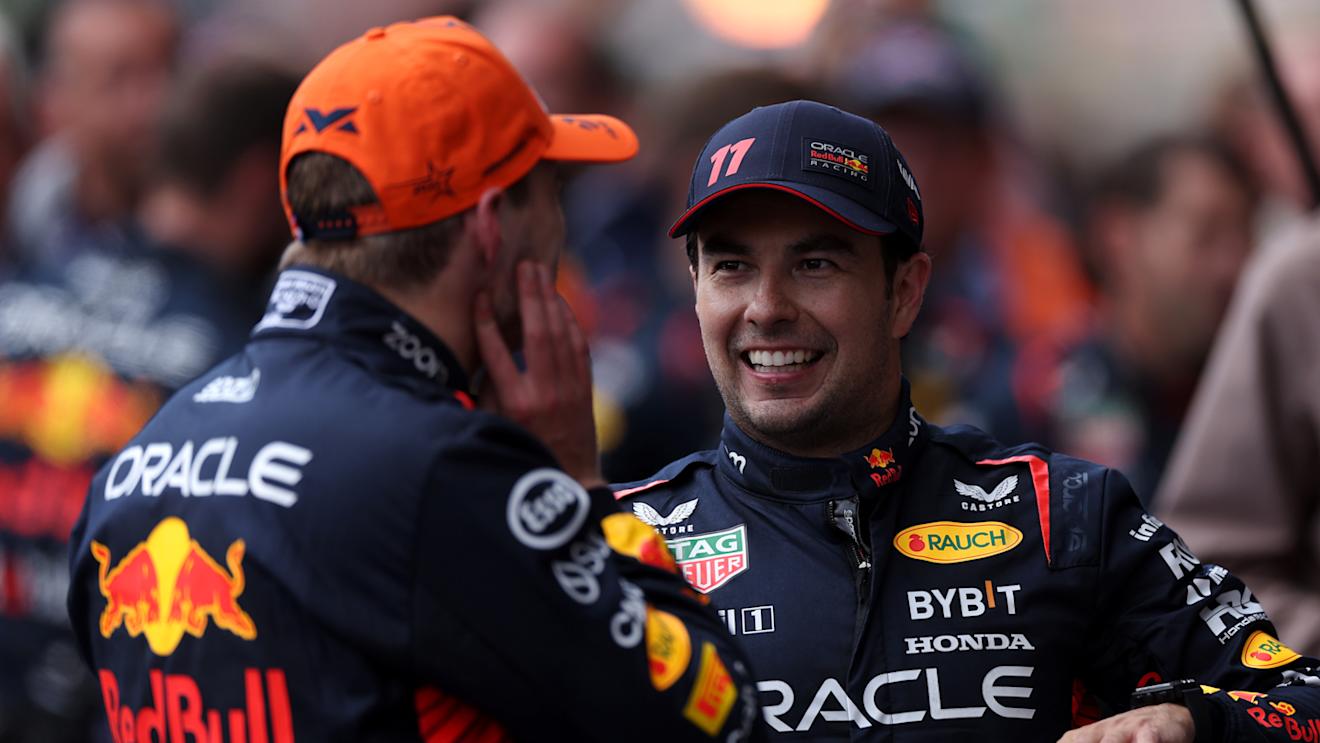 SPA, BELGIUM - JULY 30: Race winner Max Verstappen of the Netherlands and Oracle Red Bull Racing and Second placed Sergio Perez of Mexico and Oracle Red Bull Racing talk in parc ferme during the F1 Grand Prix of Belgium at Circuit de Spa-Francorchamps on July 30, 2023 in Spa, Belgium. (Photo by Dean Mouhtaropoulos - Formula 1/Formula 1 via Getty Images)