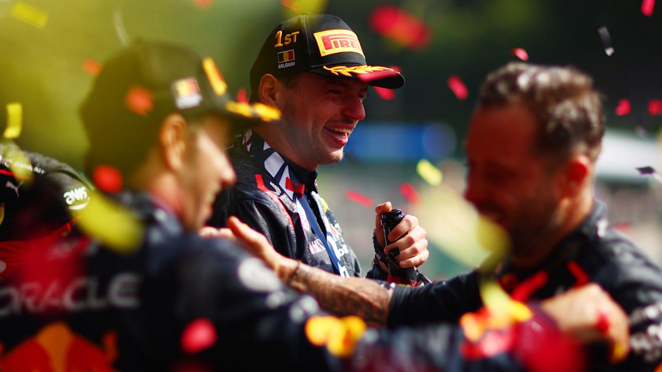 SPA, BELGIUM - JULY 30: Race winner Max Verstappen of the Netherlands and Oracle Red Bull Racing celebrates on the podium with team-mate Sergio Perez of Mexico and Oracle Red Bull Racing during the F1 Grand Prix of Belgium at Circuit de Spa-Francorchamps on July 30, 2023 in Spa, Belgium. (Photo by Dan Istitene - Formula 1/Formula 1 via Getty Images)
