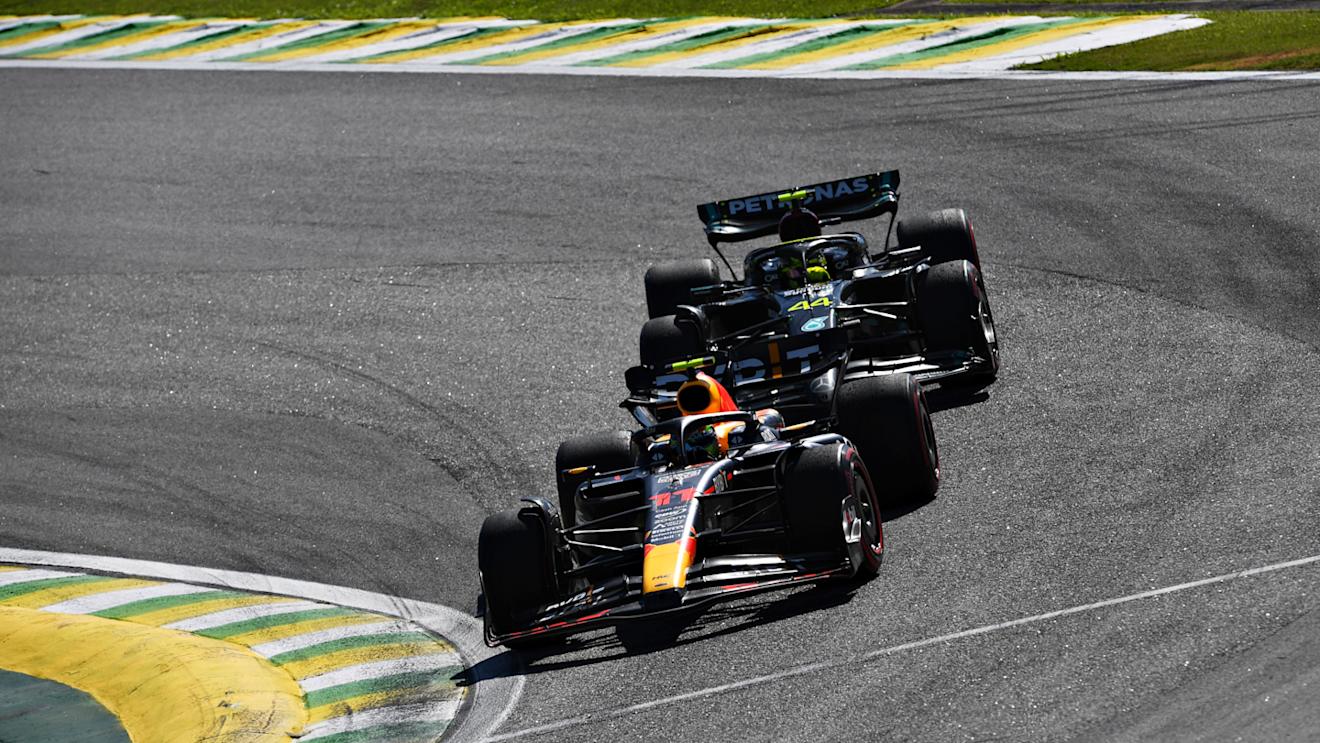 SAO PAULO, BRAZIL - NOVEMBER 05: Sergio Perez of Mexico driving the (11) Oracle Red Bull Racing RB19 leads Lewis Hamilton of Great Britain driving the (44) Mercedes AMG Petronas F1 Team W14 during the F1 Grand Prix of Brazil at Autodromo Jose Carlos Pace on November 05, 2023 in Sao Paulo, Brazil. (Photo by Rudy Carezzevoli/Getty Images)