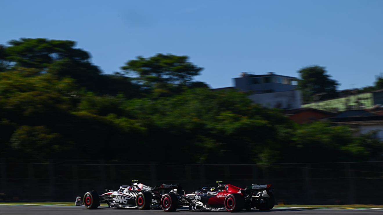 SAO PAULO, BRAZIL - NOVEMBER 04: Nico Hulkenberg of Germany driving the (27) Haas F1 VF-23 Ferrari leads Zhou Guanyu of China driving the (24) Alfa Romeo F1 C43 Ferrari on track during the Sprint ahead of the F1 Grand Prix of Brazil at Autodromo Jose Carlos Pace on November 04, 2023 in Sao Paulo, Brazil. (Photo by Clive Mason - Formula 1/Formula 1 via Getty Images)