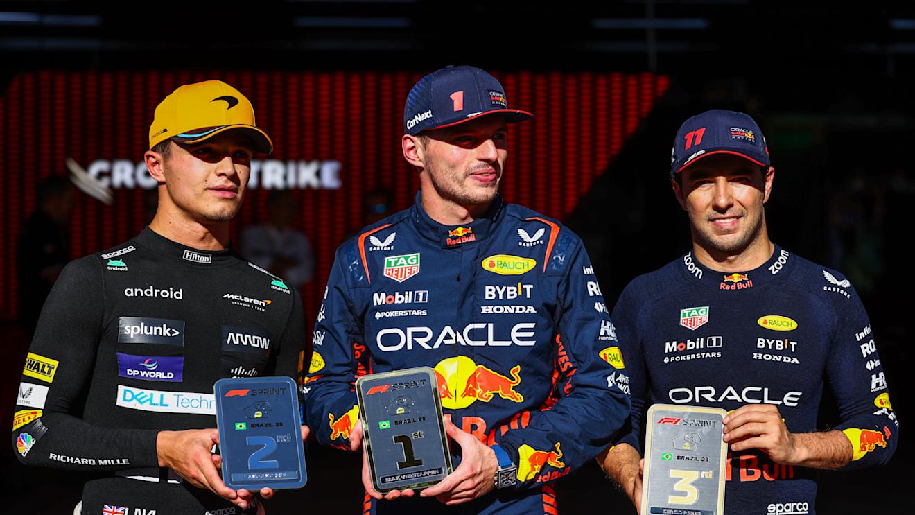 SAO PAULO, BRAZIL - NOVEMBER 04: Sprint winner Max Verstappen of the Netherlands and Oracle Red Bull Racing (C), Second placed Lando Norris of Great Britain and McLaren and Third placed Sergio Perez of Mexico and Oracle Red Bull Racing celebrate in parc ferme during the Sprint ahead of the F1 Grand Prix of Brazil at Autodromo Jose Carlos Pace on November 04, 2023 in Sao Paulo, Brazil. (Photo by Mark Thompson/Getty Images)