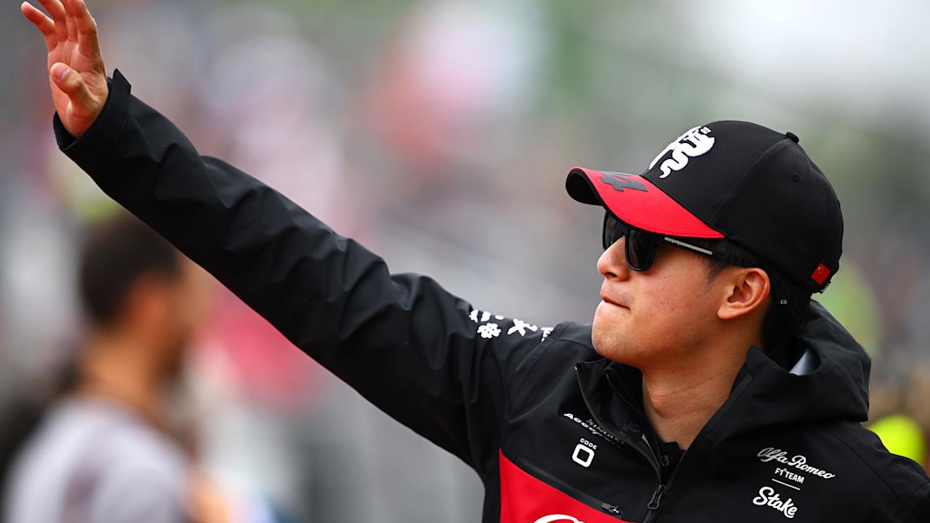 MONTREAL, QUEBEC - JUNE 18: Zhou Guanyu of China and Alfa Romeo F1 waves to the crowd on the drivers parade prior to the F1 Grand Prix of Canada at Circuit Gilles Villeneuve on June 18, 2023 in Montreal, Quebec. (Photo by Clive Mason/Getty Images)