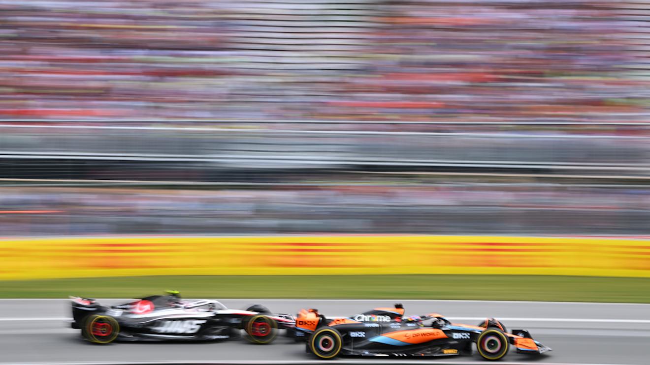 MONTREAL, QUEBEC - JUNE 18: Oscar Piastri of Australia driving the (81) McLaren MCL60 Mercedes and Nico Hulkenberg of Germany driving the (27) Haas F1 VF-23 Ferrari battle for position during the F1 Grand Prix of Canada at Circuit Gilles Villeneuve on June 18, 2023 in Montreal, Quebec. (Photo by Dan Mullan/Getty Images)
