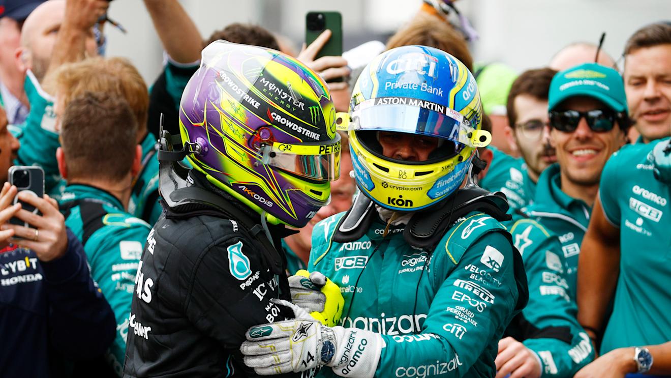MONTREAL, QUEBEC - JUNE 18: Second placed Fernando Alonso of Spain and Aston Martin F1 Team and Third placed Lewis Hamilton of Great Britain and Mercedes celebrate in parc ferme during the F1 Grand Prix of Canada at Circuit Gilles Villeneuve on June 18, 2023 in Montreal, Quebec. (Photo by Jared C. Tilton/Getty Images)