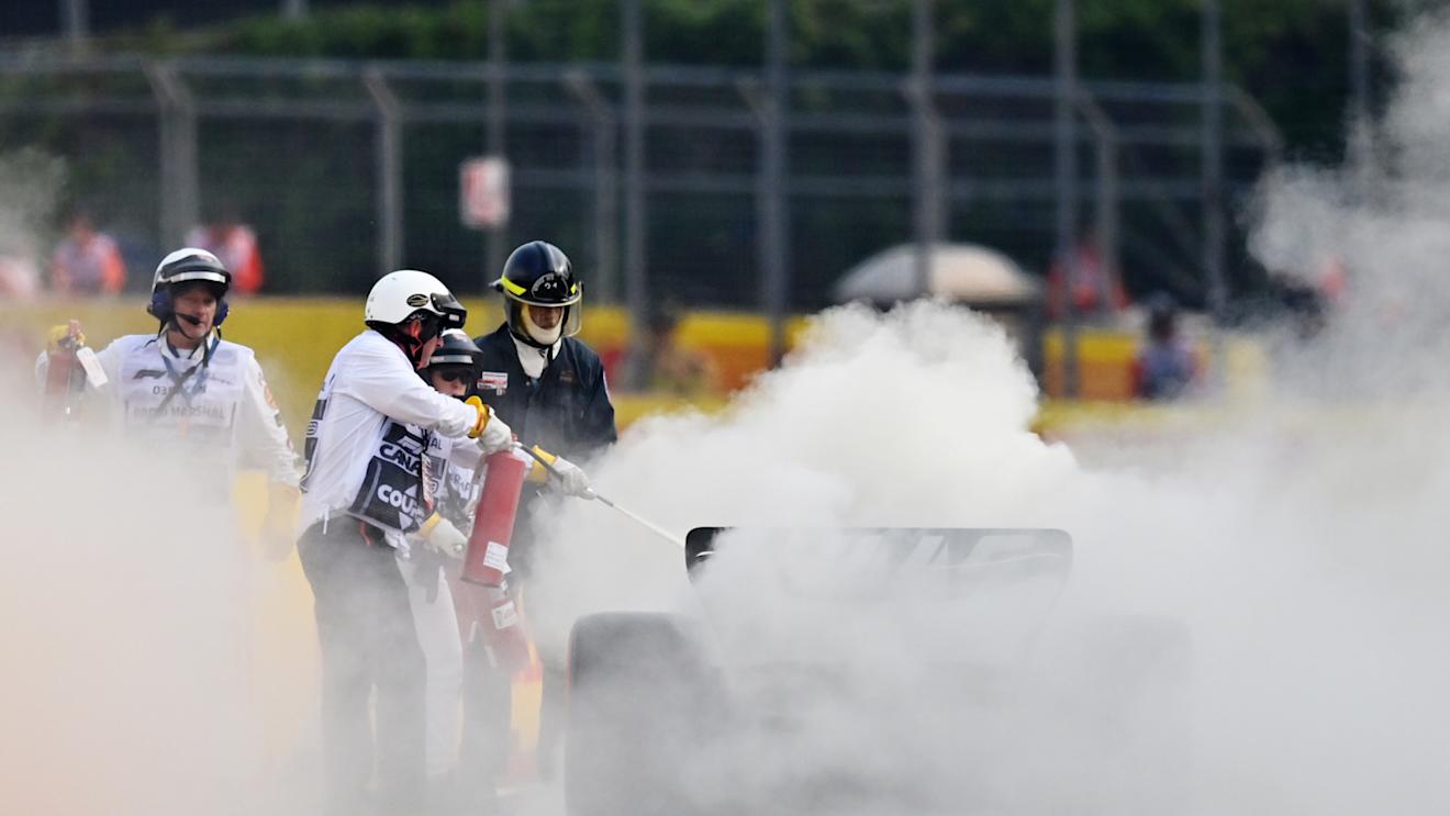 MONTREAL, QUEBEC - JUNE 16: Track marshals use fire extinguishers on the car of Nico Hulkenberg of Germany and Haas F1 during practice ahead of the F1 Grand Prix of Canada at Circuit Gilles Villeneuve on June 16, 2023 in Montreal, Quebec. (Photo by Dan Mullan/Getty Images)
