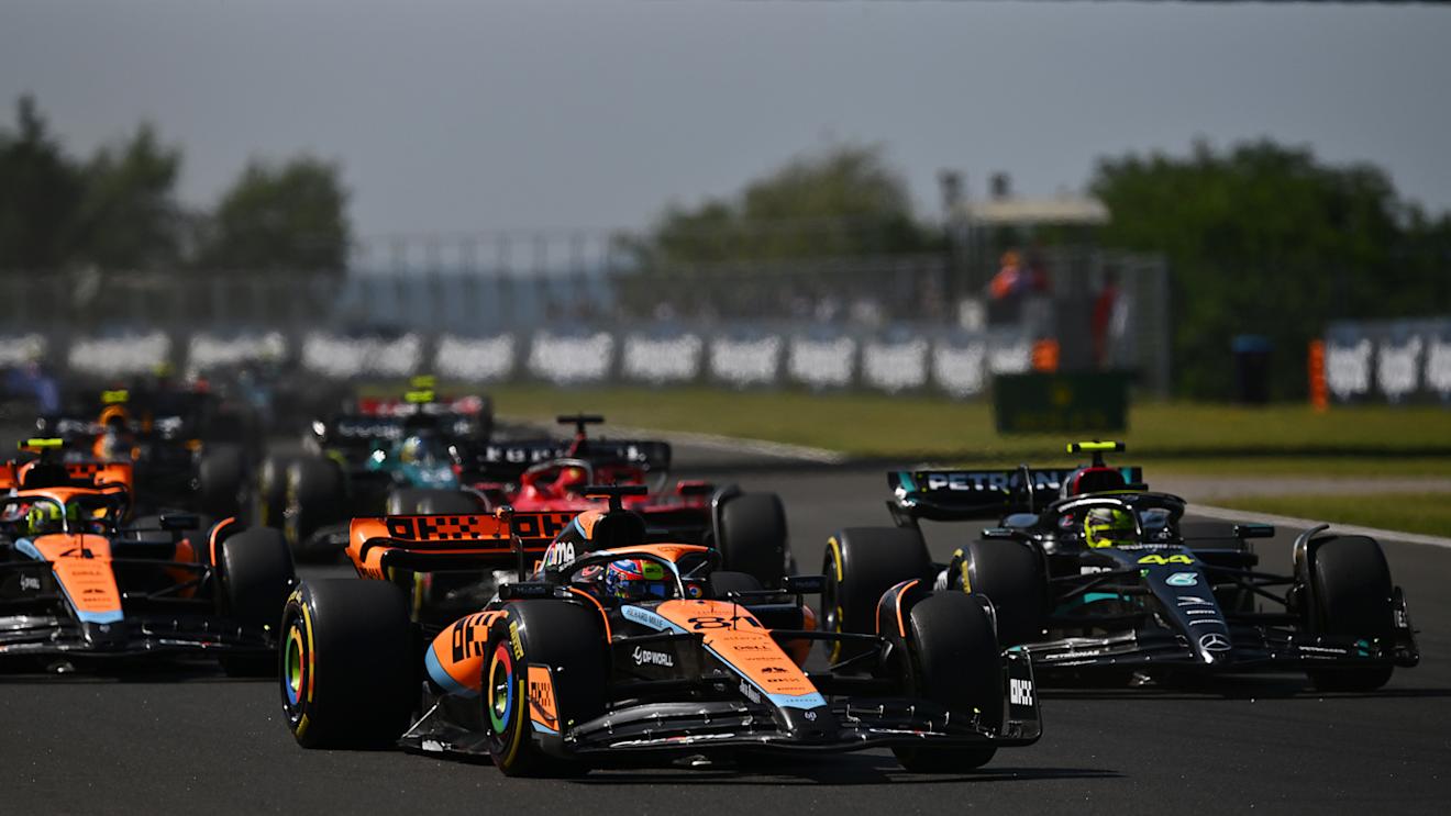 BUDAPEST, HUNGARY - JULY 23: Oscar Piastri of Australia driving the (81) McLaren MCL60 Mercedes leads Lewis Hamilton of Great Britain driving the (44) Mercedes AMG Petronas F1 Team W14 during the F1 Grand Prix of Hungary at Hungaroring on July 23, 2023 in Budapest, Hungary. (Photo by Dan Mullan/Getty Images)