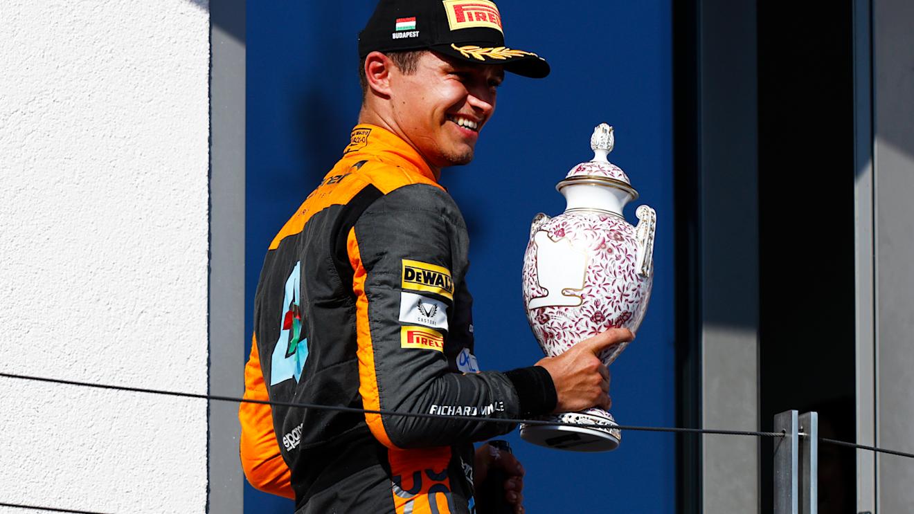 BUDAPEST, HUNGARY - JULY 23: Second placed Lando Norris of Great Britain and McLaren celebrates on the podium during the F1 Grand Prix of Hungary at Hungaroring on July 23, 2023 in Budapest, Hungary. (Photo by Francois Nel/Getty Images)