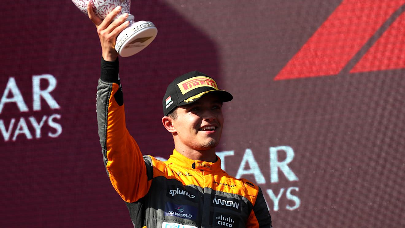 BUDAPEST, HUNGARY - JULY 23: Second placed Lando Norris of Great Britain and McLaren celebrates on the podium during the F1 Grand Prix of Hungary at Hungaroring on July 23, 2023 in Budapest, Hungary. (Photo by Peter Fox/Getty Images)