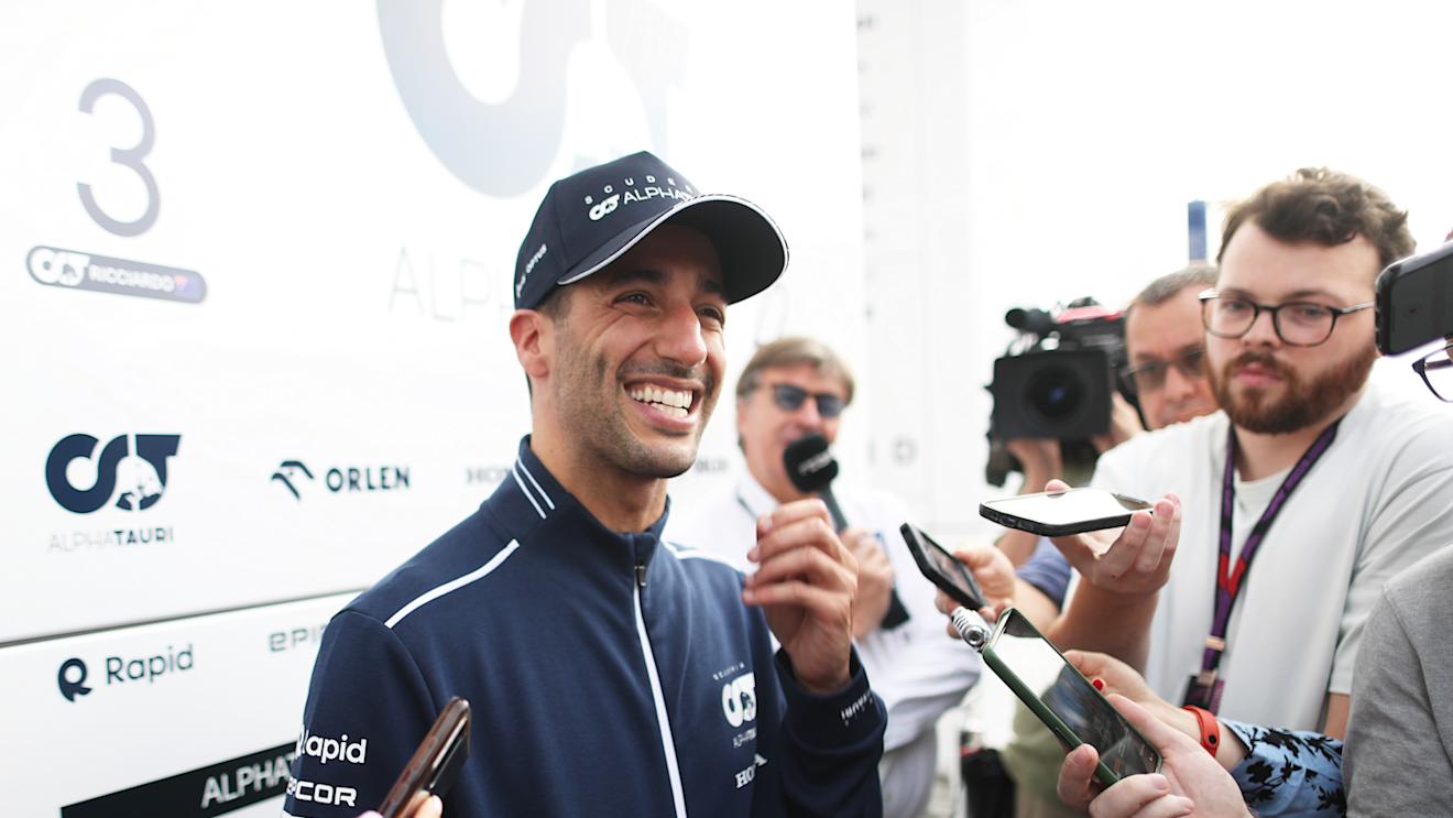 BUDAPEST, HUNGARY - JULY 21: Daniel Ricciardo of Australia and Scuderia AlphaTauri talks to the media in the Paddock after practice ahead of the F1 Grand Prix of Hungary at Hungaroring on July 21, 2023 in Budapest, Hungary. (Photo by Peter Fox/Getty Images)