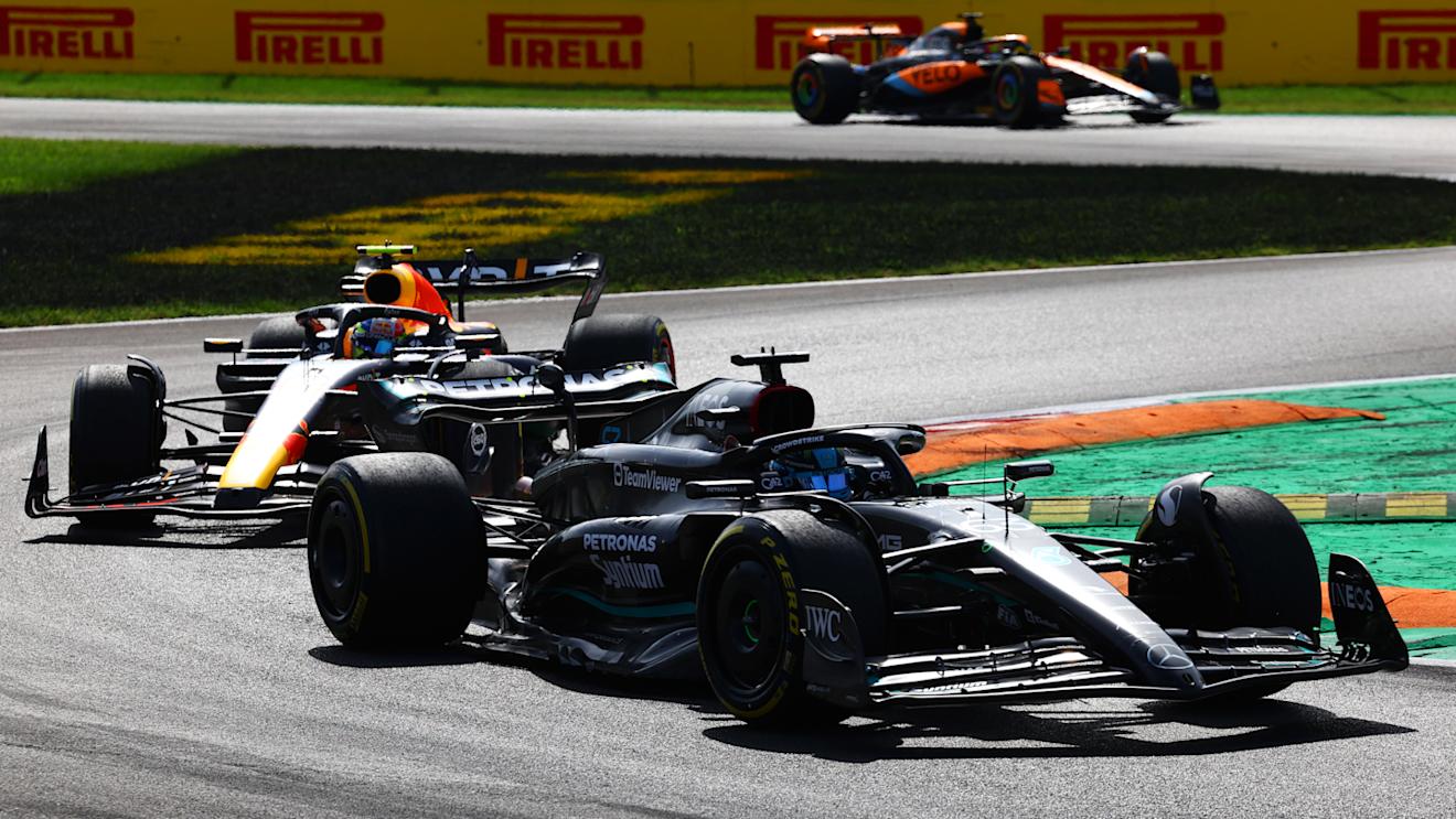 MONZA, ITALY - SEPTEMBER 03: George Russell of Great Britain driving the (63) Mercedes AMG Petronas F1 Team W14 leads Sergio Perez of Mexico driving the (11) Oracle Red Bull Racing RB19 during the F1 Grand Prix of Italy at Autodromo Nazionale Monza on September 03, 2023 in Monza, Italy. (Photo by Mark Thompson/Getty Images)