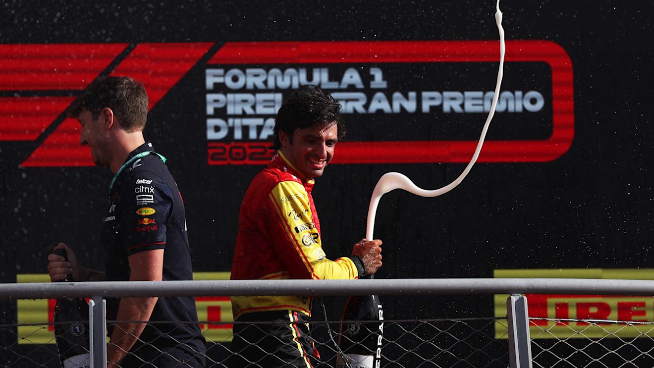 MONZA, ITALY - SEPTEMBER 03: Third placed Carlos Sainz of Spain and Ferrari celebrates on the podium during the F1 Grand Prix of Italy at Autodromo Nazionale Monza on September 03, 2023 in Monza, Italy. (Photo by Ryan Pierse/Getty Images)