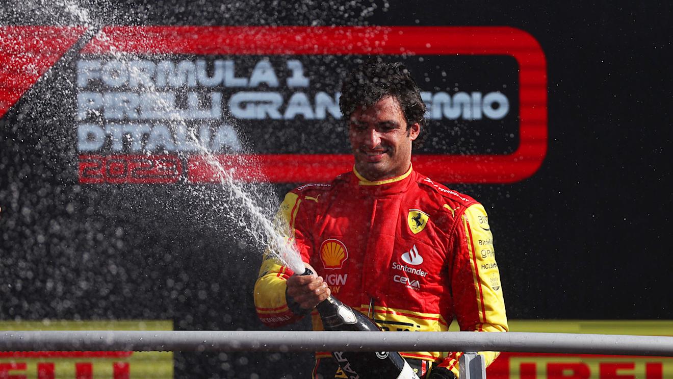 MONZA, ITALY - SEPTEMBER 03: Third placed Carlos Sainz of Spain and Ferrari celebrates on the podium during the F1 Grand Prix of Italy at Autodromo Nazionale Monza on September 03, 2023 in Monza, Italy. (Photo by Ryan Pierse/Getty Images)