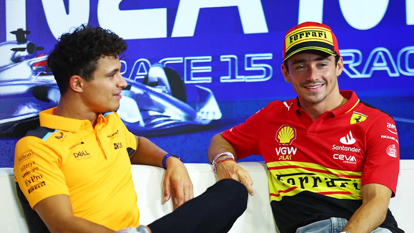 MONZA, ITALY - AUGUST 31: Charles Leclerc of Monaco and Ferrari and Lando Norris of Great Britain and McLaren talk in the Drivers Press Conference during previews ahead of the F1 Grand Prix of Italy at Autodromo Nazionale Monza on August 31, 2023 in Monza, Italy. (Photo by Bryn Lennon/Getty Images)