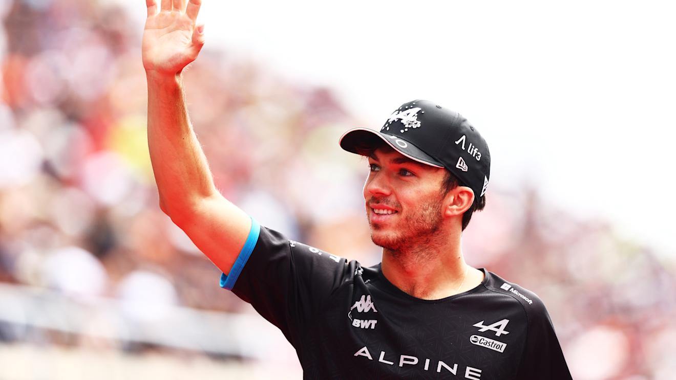 SUZUKA, JAPAN - SEPTEMBER 24: Pierre Gasly of France and Alpine F1 waves from the drivers parade prior to the F1 Grand Prix of Japan at Suzuka International Racing Course on September 24, 2023 in Suzuka, Japan. (Photo by Clive Rose/Getty Images)