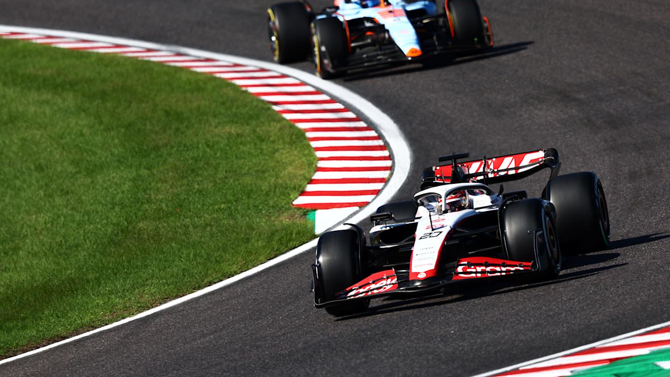SUZUKA, JAPAN - SEPTEMBER 24: Kevin Magnussen of Denmark driving the (20) Haas F1 VF-23 Ferrari leads Logan Sargeant of United States driving the (2) Williams FW45 Mercedes during the F1 Grand Prix of Japan at Suzuka International Racing Course on September 24, 2023 in Suzuka, Japan. (Photo by Clive Rose/Getty Images)