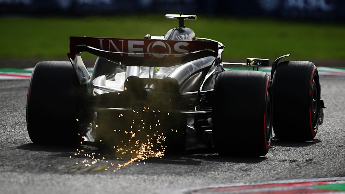 SUZUKA, JAPAN - SEPTEMBER 23: Sparks fly behind Lewis Hamilton of Great Britain driving the (44) Mercedes AMG Petronas F1 Team W14 during qualifying ahead of the F1 Grand Prix of Japan at Suzuka International Racing Course on September 23, 2023 in Suzuka, Japan. (Photo by Clive Mason/Getty Images)