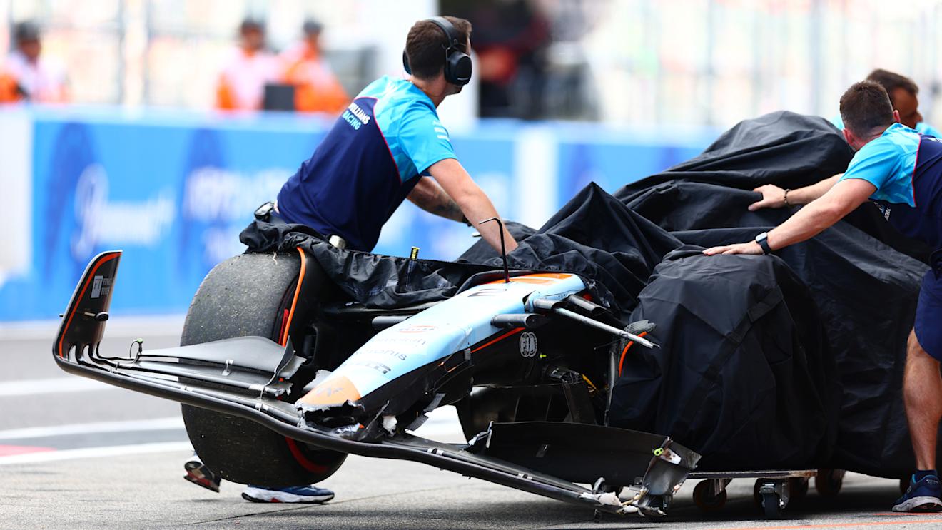 SUZUKA, JAPAN - SEPTEMBER 23: The car of Logan Sargeant of United States and Williams is pushed back into the garage after a crash during qualifying ahead of the F1 Grand Prix of Japan at Suzuka International Racing Course on September 23, 2023 in Suzuka, Japan. (Photo by Dan Istitene - Formula 1/Formula 1 via Getty Images)