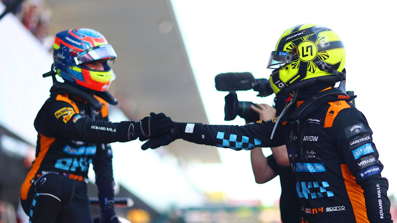 SUZUKA, JAPAN - SEPTEMBER 23:  Second placed qualifier Oscar Piastri of Australia and McLaren celebrates with Third placed qualifier Lando Norris of Great Britain and McLaren in parc ferme during qualifying ahead of the F1 Grand Prix of Japan at Suzuka International Racing Course on September 23, 2023 in Suzuka, Japan. (Photo by Dan Istitene - Formula 1/Formula 1 via Getty Images)
