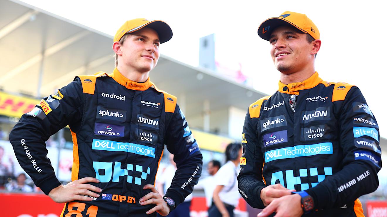 SUZUKA, JAPAN - SEPTEMBER 23:  Second placed qualifier Oscar Piastri of Australia and McLaren talks with Third placed qualifier Lando Norris of Great Britain and McLaren in parc ferme during qualifying ahead of the F1 Grand Prix of Japan at Suzuka International Racing Course on September 23, 2023 in Suzuka, Japan. (Photo by Dan Istitene - Formula 1/Formula 1 via Getty Images)