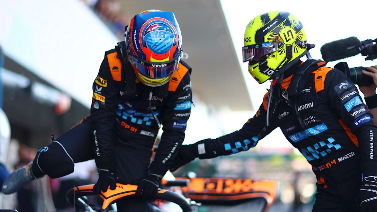 SUZUKA, JAPAN - SEPTEMBER 23:  Second placed qualifier Oscar Piastri of Australia and McLaren is congratulated by Third placed qualifier Lando Norris of Great Britain and McLaren as he climbs out of his car in parc ferme during qualifying ahead of the F1 Grand Prix of Japan at Suzuka International Racing Course on September 23, 2023 in Suzuka, Japan. (Photo by Dan Istitene - Formula 1/Formula 1 via Getty Images)