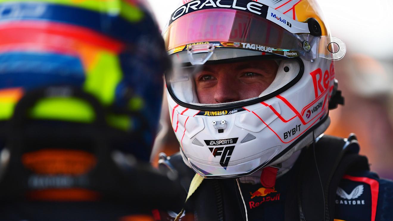 SUZUKA, JAPAN - SEPTEMBER 23: Pole position qualifier Max Verstappen of the Netherlands and Oracle Red Bull Racing talks with second placed qualifier Oscar Piastri of Australia and McLaren in parc ferme during qualifying ahead of the F1 Grand Prix of Japan at Suzuka International Racing Course on September 23, 2023 in Suzuka, Japan. (Photo by Mario Renzi - Formula 1/Formula 1 via Getty Images)