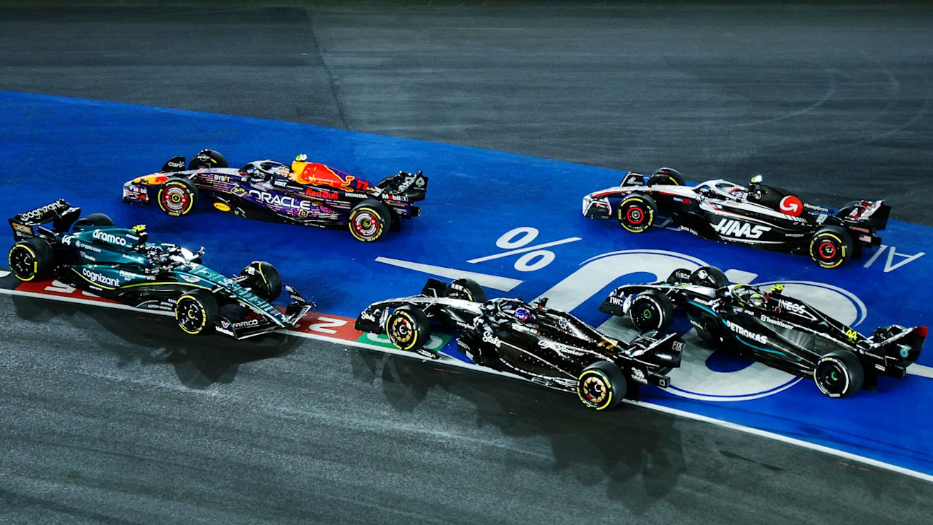 LAS VEGAS, NEVADA - NOVEMBER 18: Fernando Alonso of Spain driving the (14) Aston Martin AMR23 Mercedes and Valtteri Bottas of Finland driving the (77) Alfa Romeo F1 C43 Ferrari collide at turn one during the F1 Grand Prix of Las Vegas at Las Vegas Strip Circuit on November 18, 2023 in Las Vegas, Nevada. (Photo by Chris Graythen/Getty Images)