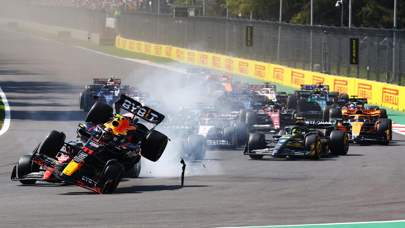 MEXICO CITY, MEXICO - OCTOBER 29: Sergio Perez of Mexico driving the (11) Oracle Red Bull Racing RB19 collides with Charles Leclerc of Monaco driving the (16) Ferrari SF-23 into the first corner at the start of the race during the F1 Grand Prix of Mexico at Autodromo Hermanos Rodriguez on October 29, 2023 in Mexico City, Mexico. (Photo by Mark Thompson/Getty Images)
