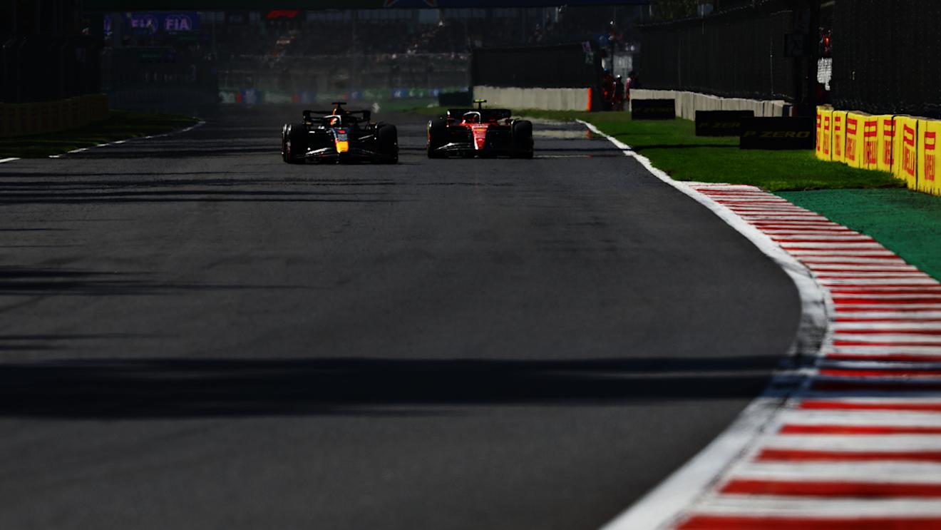 MEXICO CITY, MEXICO - OCTOBER 29: Max Verstappen of the Netherlands driving the (1) Oracle Red Bull Racing RB19 overtakes Carlos Sainz of Spain driving (55) the Ferrari SF-23 during the F1 Grand Prix of Mexico at Autodromo Hermanos Rodriguez on October 29, 2023 in Mexico City, Mexico. (Photo by Mark Thompson/Getty Images)
