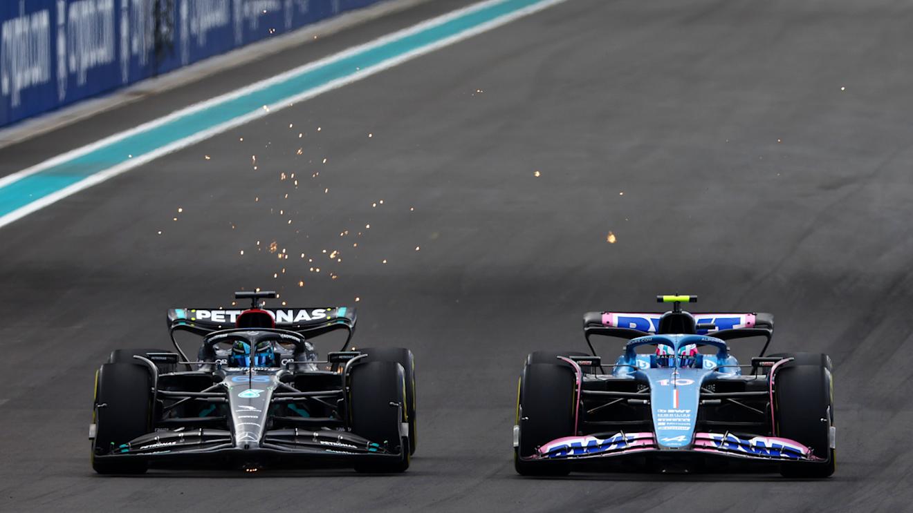 MIAMI, FLORIDA - MAY 07: George Russell of Great Britain driving the (63) Mercedes AMG Petronas F1 Team W14 and Esteban Ocon of France driving the (31) Alpine F1 A523 Renault battle for track position during the F1 Grand Prix of Miami at Miami International Autodrome on May 07, 2023 in Miami, Florida. (Photo by Mark Thompson/Getty Images)