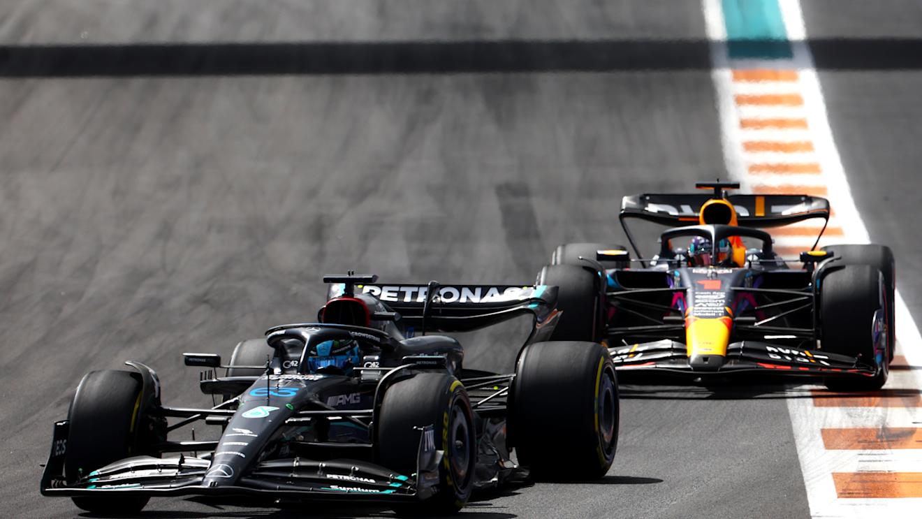MIAMI, FLORIDA - MAY 07: George Russell of Great Britain driving the (63) Mercedes AMG Petronas F1 Team W14 leads Max Verstappen of the Netherlands driving the (1) Oracle Red Bull Racing RB19 during the F1 Grand Prix of Miami at Miami International Autodrome on May 07, 2023 in Miami, Florida. (Photo by Mark Thompson/Getty Images)