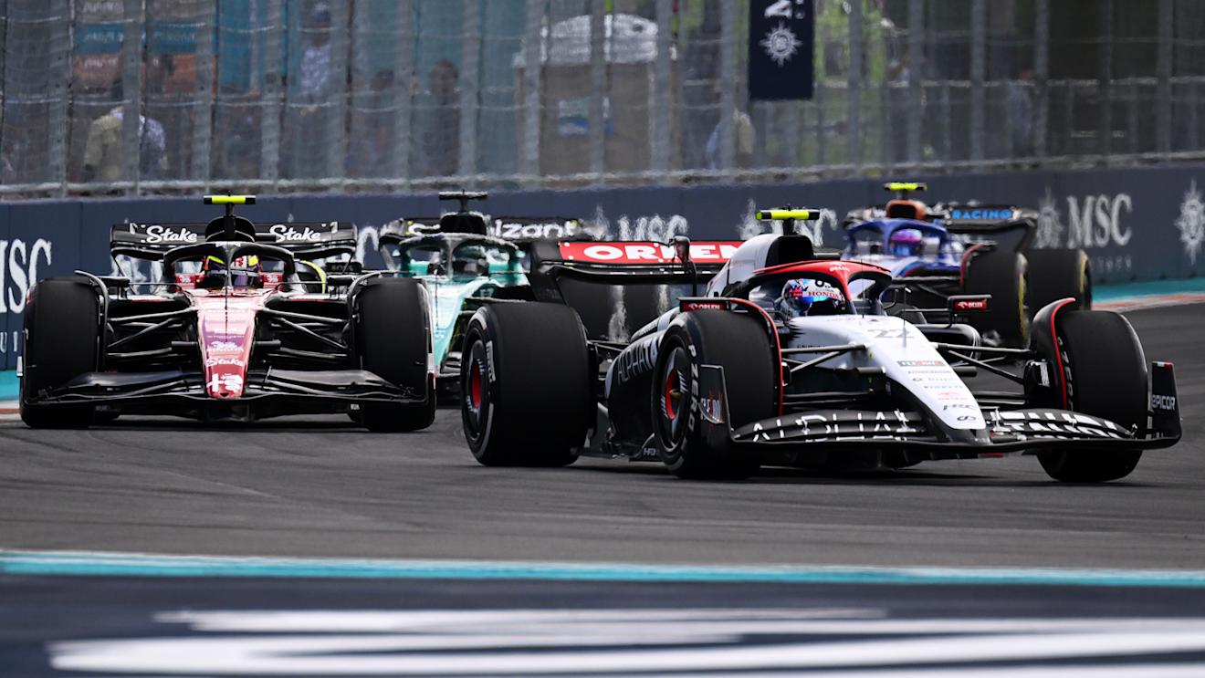 MIAMI, FLORIDA - MAY 07: Yuki Tsunoda of Japan driving the (22) Scuderia AlphaTauri AT04 leads Zhou Guanyu of China driving the (24) Alfa Romeo F1 C43 Ferrari during the F1 Grand Prix of Miami at Miami International Autodrome on May 07, 2023 in Miami, Florida. (Photo by Clive Mason - Formula 1/Formula 1 via Getty Images)