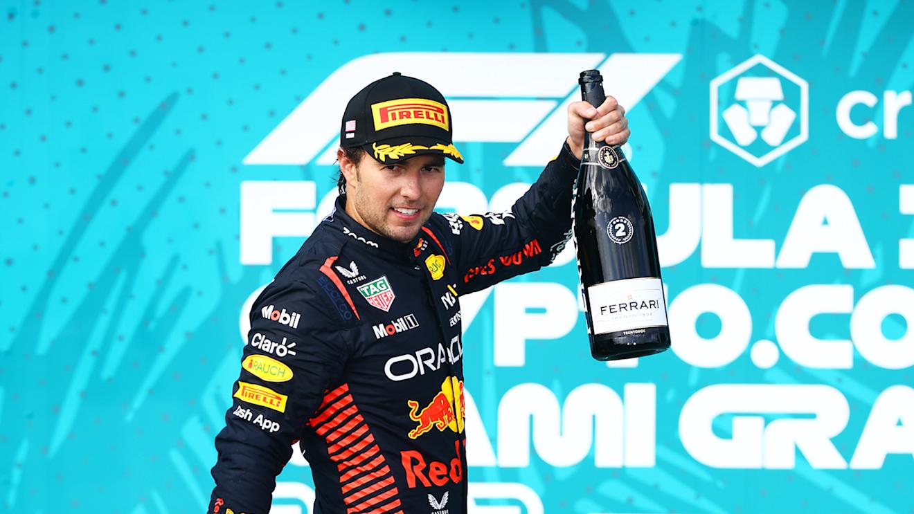 MIAMI, FLORIDA - MAY 07: Second placed Sergio Perez of Mexico and Oracle Red Bull Racing celebrates on the podium during the F1 Grand Prix of Miami at Miami International Autodrome on May 07, 2023 in Miami, Florida. (Photo by Mark Thompson/Getty Images)