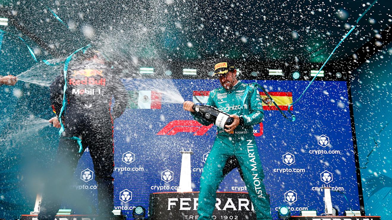 MIAMI, FLORIDA - MAY 07: Race winner Max Verstappen of the Netherlands and Oracle Red Bull Racing and Third placed Fernando Alonso of Spain and Aston Martin F1 Team celebrate on the podium during the F1 Grand Prix of Miami at Miami International Autodrome on May 07, 2023 in Miami, Florida. (Photo by Dan Istitene - Formula 1/Formula 1 via Getty Images)