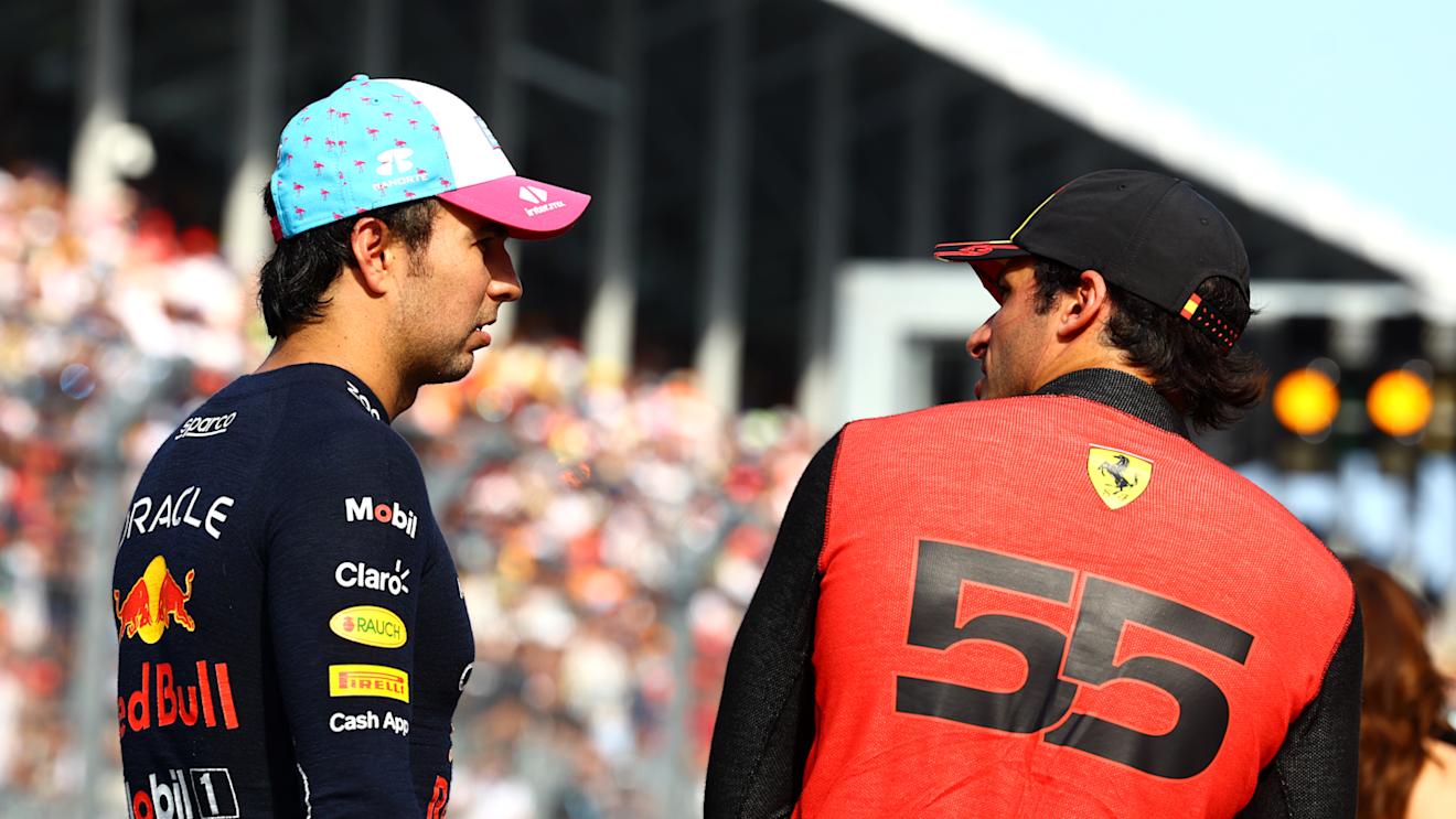 MIAMI, FLORIDA - MAY 06: Pole position qualifier Sergio Perez of Mexico and Oracle Red Bull Racing and Third placed qualifier Carlos Sainz of Spain and Ferrari talk in parc ferme during qualifying ahead of the F1 Grand Prix of Miami at Miami International Autodrome on May 06, 2023 in Miami, Florida. (Photo by Mark Thompson/Getty Images)