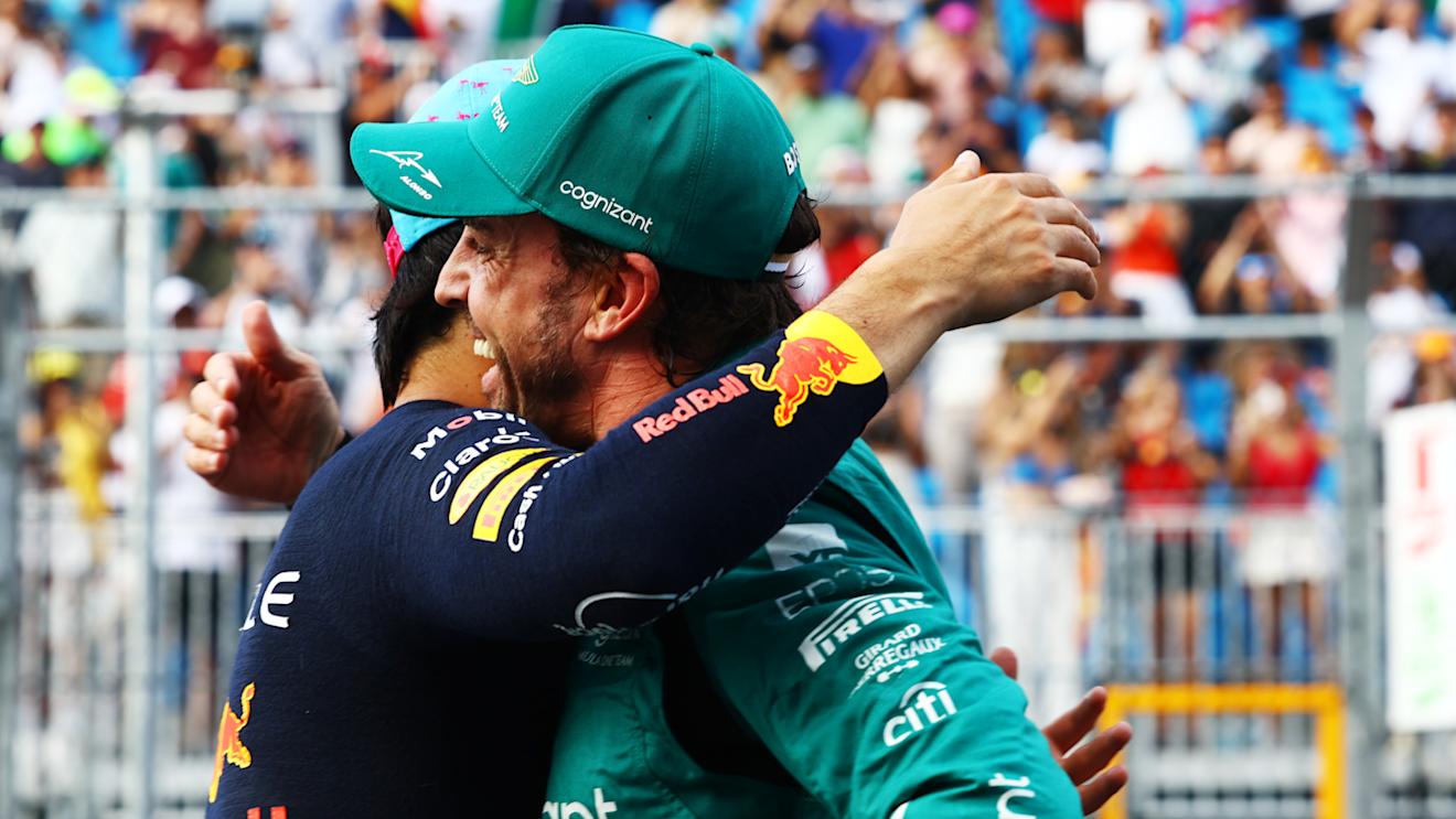MIAMI, FLORIDA - MAY 06: Second placed qualifier Fernando Alonso of Spain and Aston Martin F1 Team and Pole position qualifier Sergio Perez of Mexico and Oracle Red Bull Racing talk in parc ferme during qualifying ahead of the F1 Grand Prix of Miami at Miami International Autodrome on May 06, 2023 in Miami, Florida. (Photo by Mark Thompson/Getty Images)