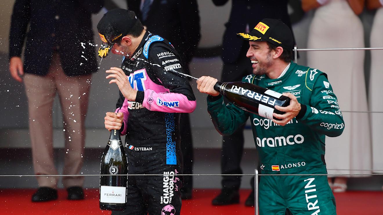 MONTE-CARLO, MONACO - MAY 28: Second placed Fernando Alonso of Spain and Aston Martin F1 Team and Third placed Esteban Ocon of France and Alpine F1 celebrate on the podium during the F1 Grand Prix of Monaco at Circuit de Monaco on May 28, 2023 in Monte-Carlo, Monaco. (Photo by Rudy Carezzevoli - Formula 1/Formula 1 via Getty Images)