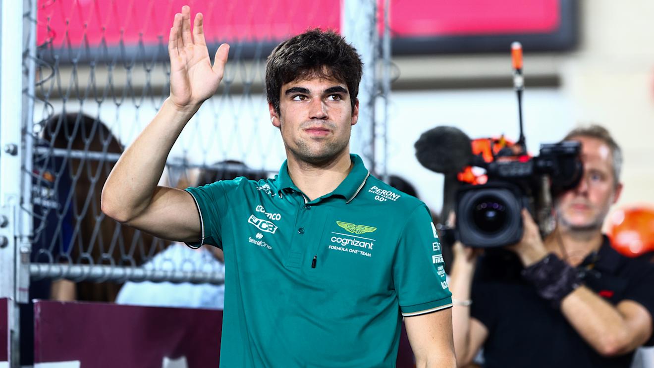 LUSAIL CITY, QATAR - OCTOBER 08: Lance Stroll of Canada and Aston Martin F1 Team waves to the crowd on the drivers parade prior to the F1 Grand Prix of Qatar at Lusail International Circuit on October 08, 2023 in Lusail City, Qatar. (Photo by Clive Rose/Getty Images)