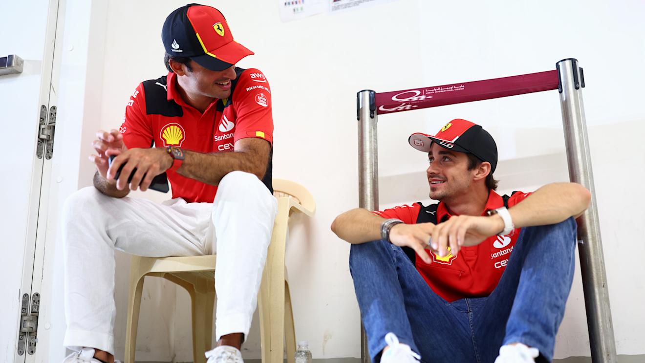 LUSAIL CITY, QATAR - OCTOBER 08: Carlos Sainz of Spain and Ferrari and Charles Leclerc of Monaco and Ferrari talk on the drivers parade prior to the F1 Grand Prix of Qatar at Lusail International Circuit on October 08, 2023 in Lusail City, Qatar. (Photo by Dan Istitene - Formula 1/Formula 1 via Getty Images)