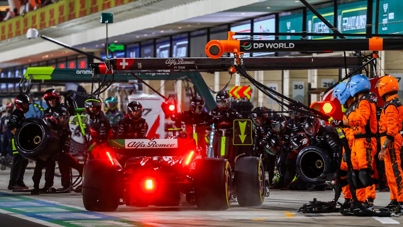 LUSAIL CITY, QATAR - OCTOBER 08: Zhou Guanyu of China driving the (24) Alfa Romeo F1 C43 Ferrari makes a pitstop during the F1 Grand Prix of Qatar at Lusail International Circuit on October 08, 2023 in Lusail City, Qatar. (Photo by Mark Thompson/Getty Images)
